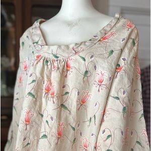 Breezy top with bell shaped sleeves and a collar bone showoff neckline.